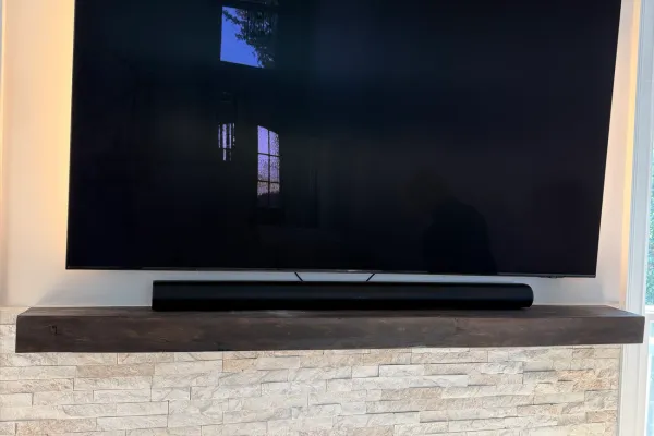 Wall-mounting TVs on Hialeah's concrete-block walls