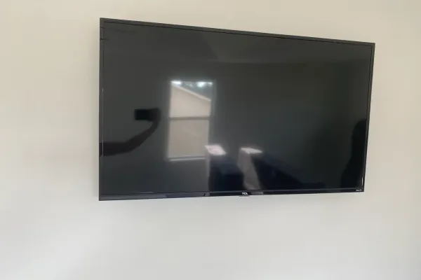 Wall-mounting TVs in Pinecrest's CBS and custom-built homes