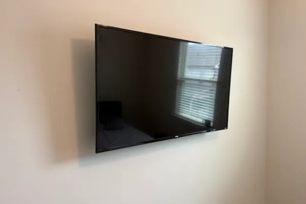 Full-motion mounts and surface cable runs on Hialeah block